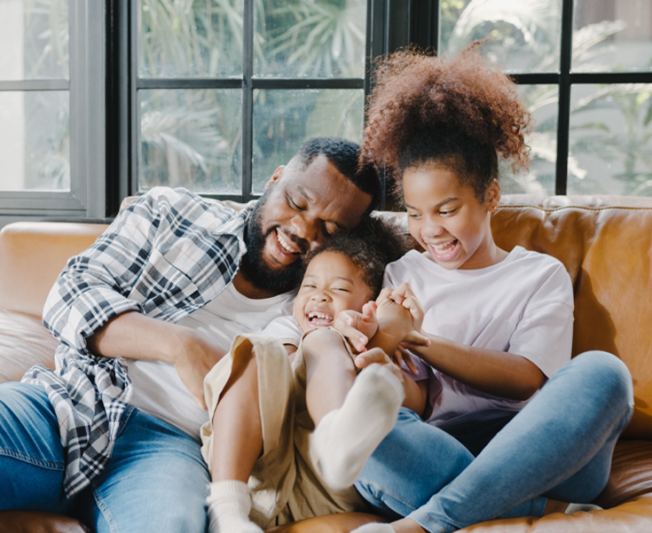 family sitting on a couch